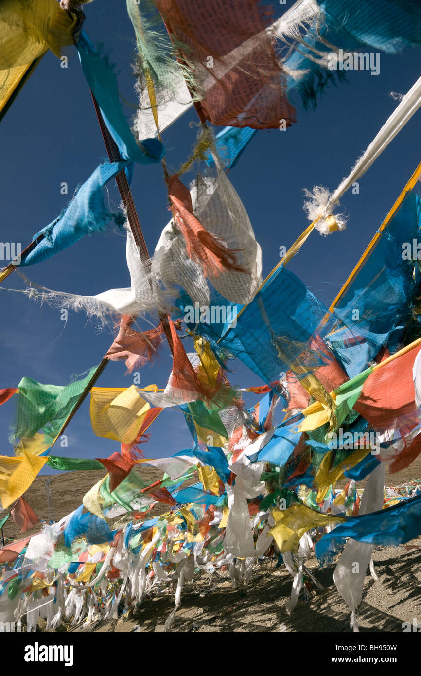 prayer flags at the summit of the tsuo la pass on the friendship highway tibet Stock Photo