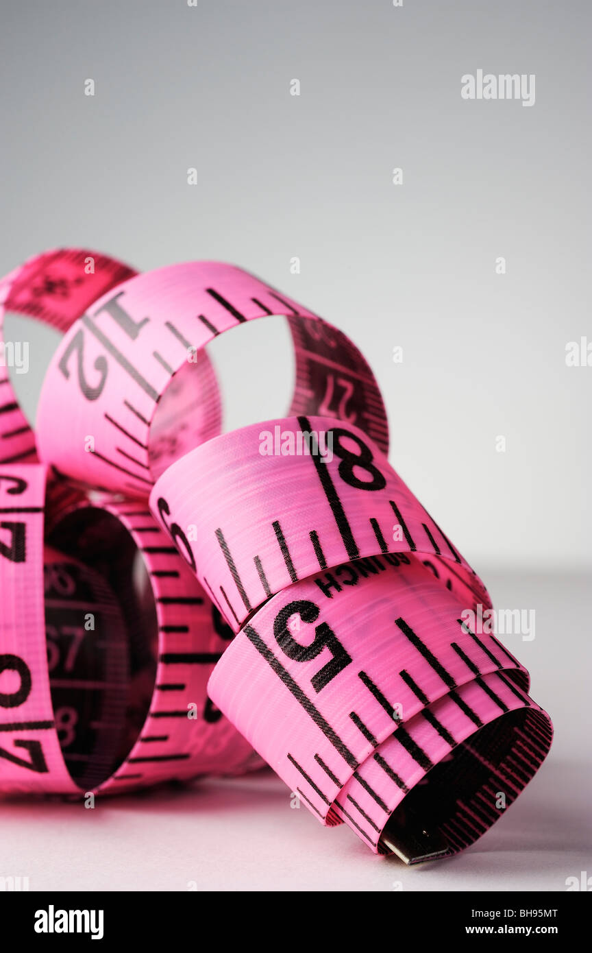 pink dress makers tape measure Stock Photo