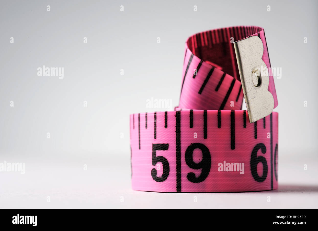 pink dress makers tape measure Stock Photo Alamy