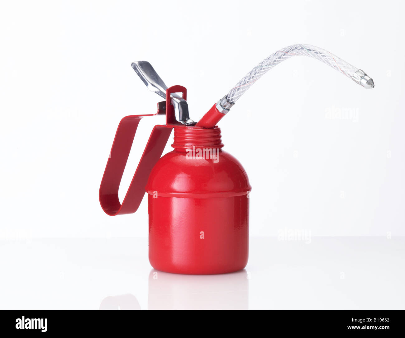 Traditional red oil can on a white background Stock Photo Alamy