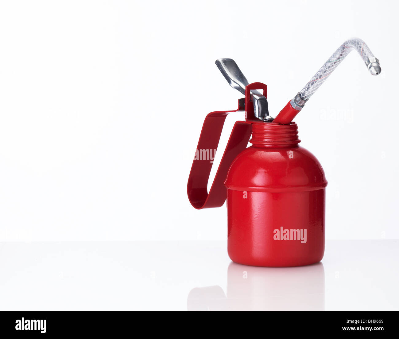 Traditional red oil can on a white background Stock Photo Alamy