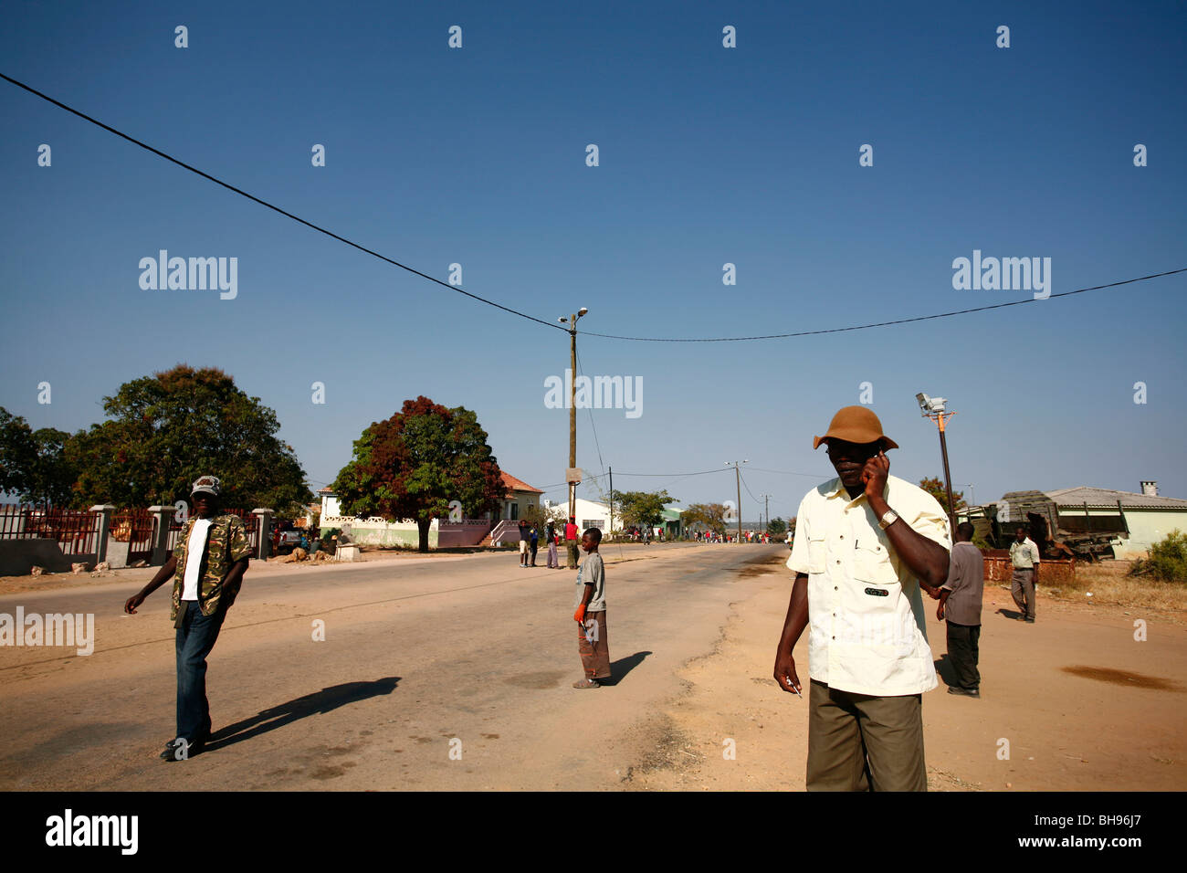 An Angolan man talks on his mobile phone in Cuito Cuanavale, Southern Angola, Africa. Stock Photo