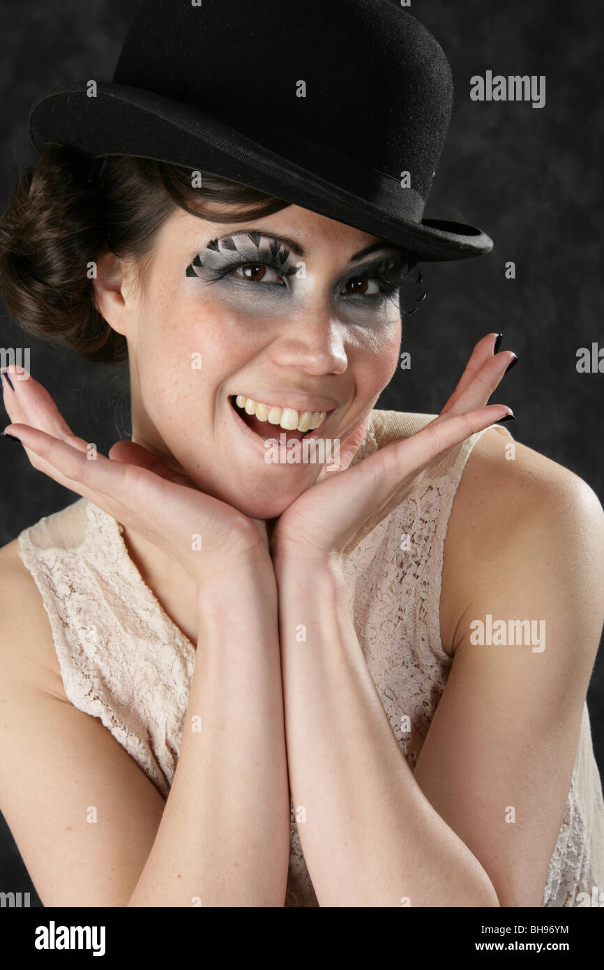Portrait of a Smiling Burlesque Performer Wearing a Bowler Hat Stock Photo