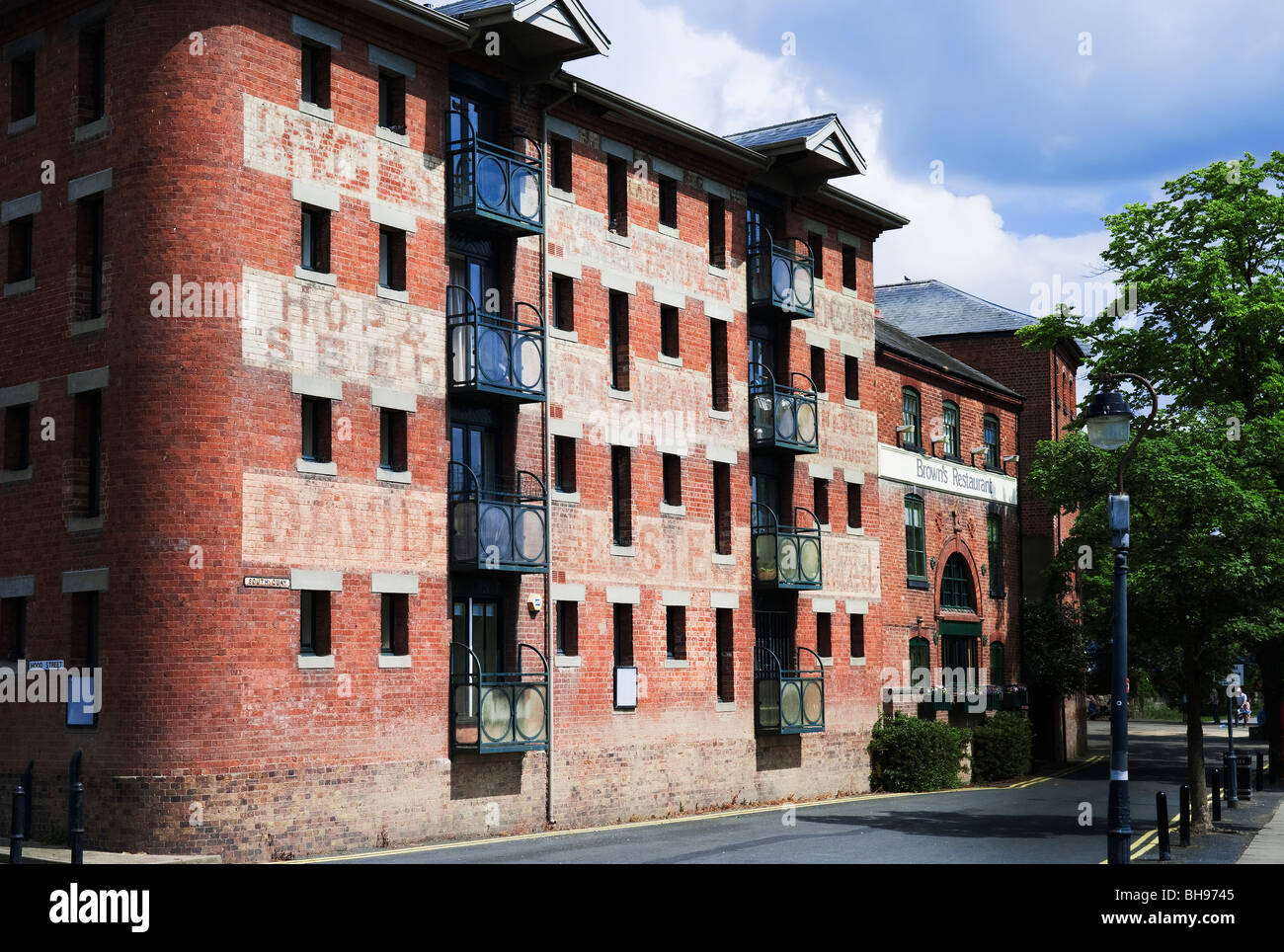 converted mill and industrial buildings alongside the river severn in