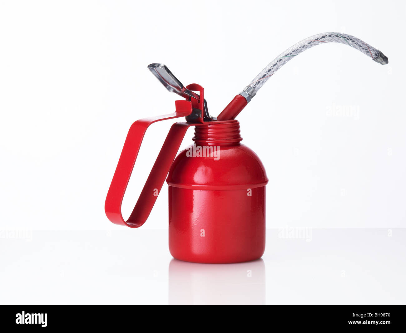 Traditional red oil can on a white background Stock Photo - Alamy