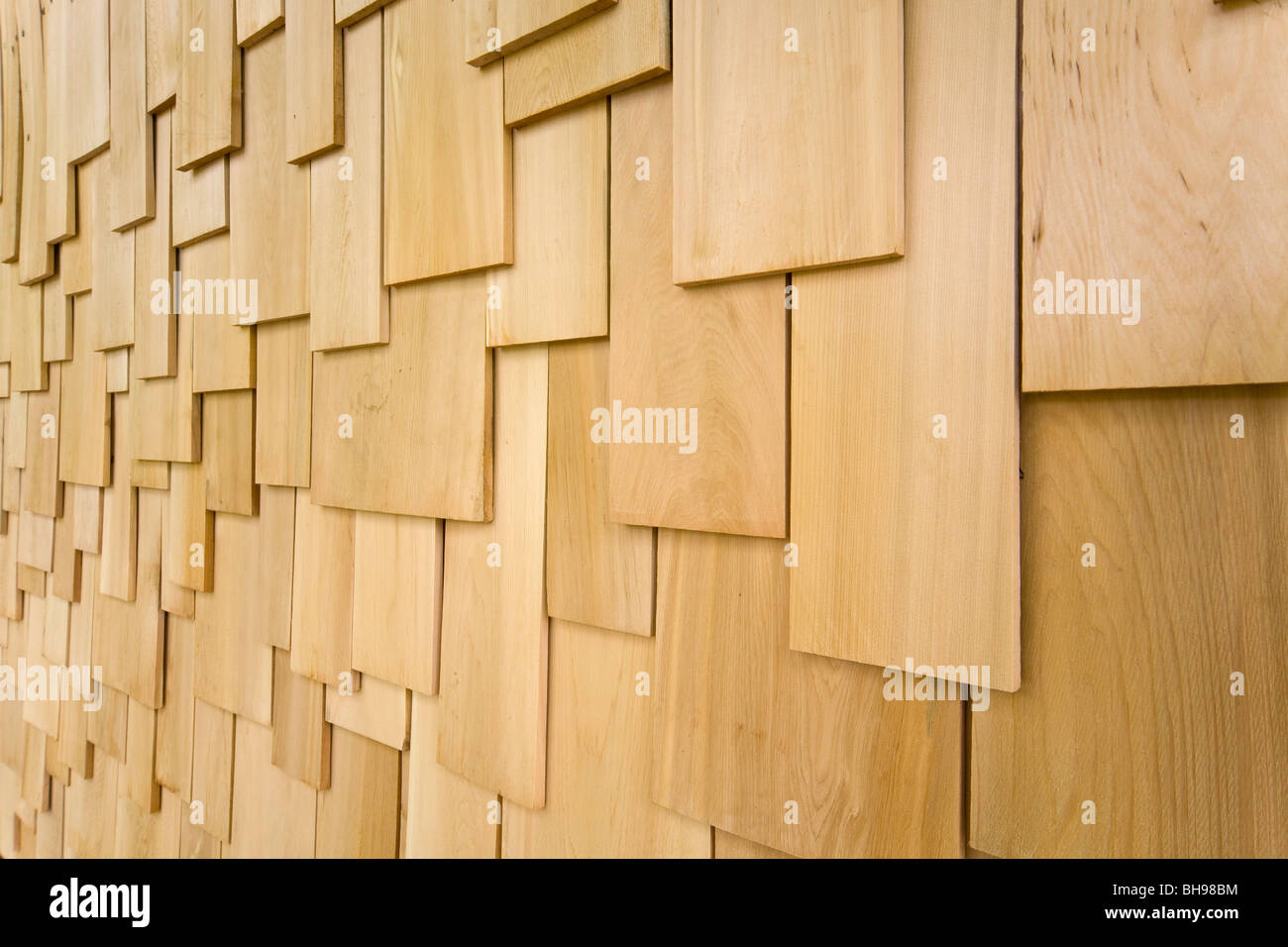 Softwood shingles cladding outside of eco building Stock Photo