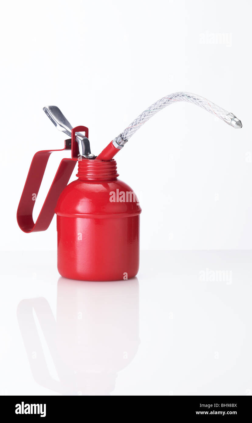 Traditional red oil can on a white background Stock Photo - Alamy