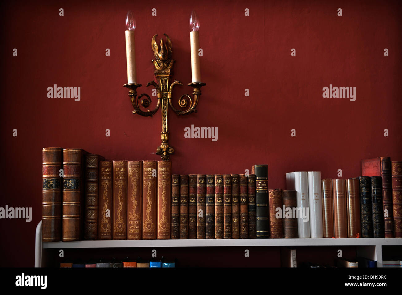 Light fitting above a bookshelf in the library of an English country
