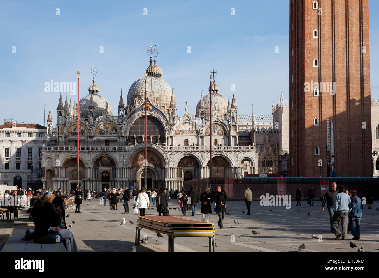 Basilica di San Marco facade and tourists walking in the Piazza San Marco, Venice Stock Photo