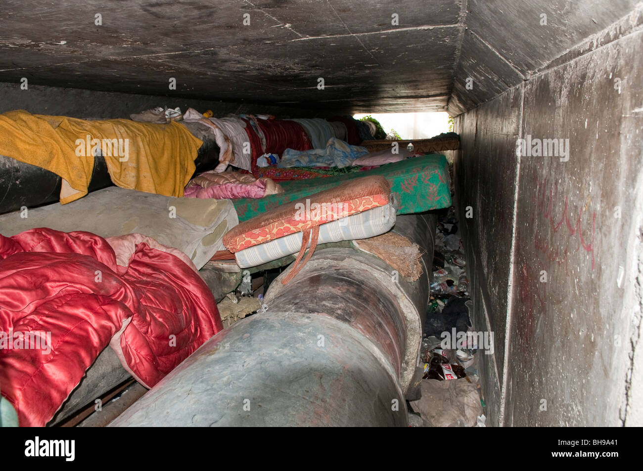 Homeless bedding on steam pipes underground in Ploiesti Romania Eastern Europe Stock Photo