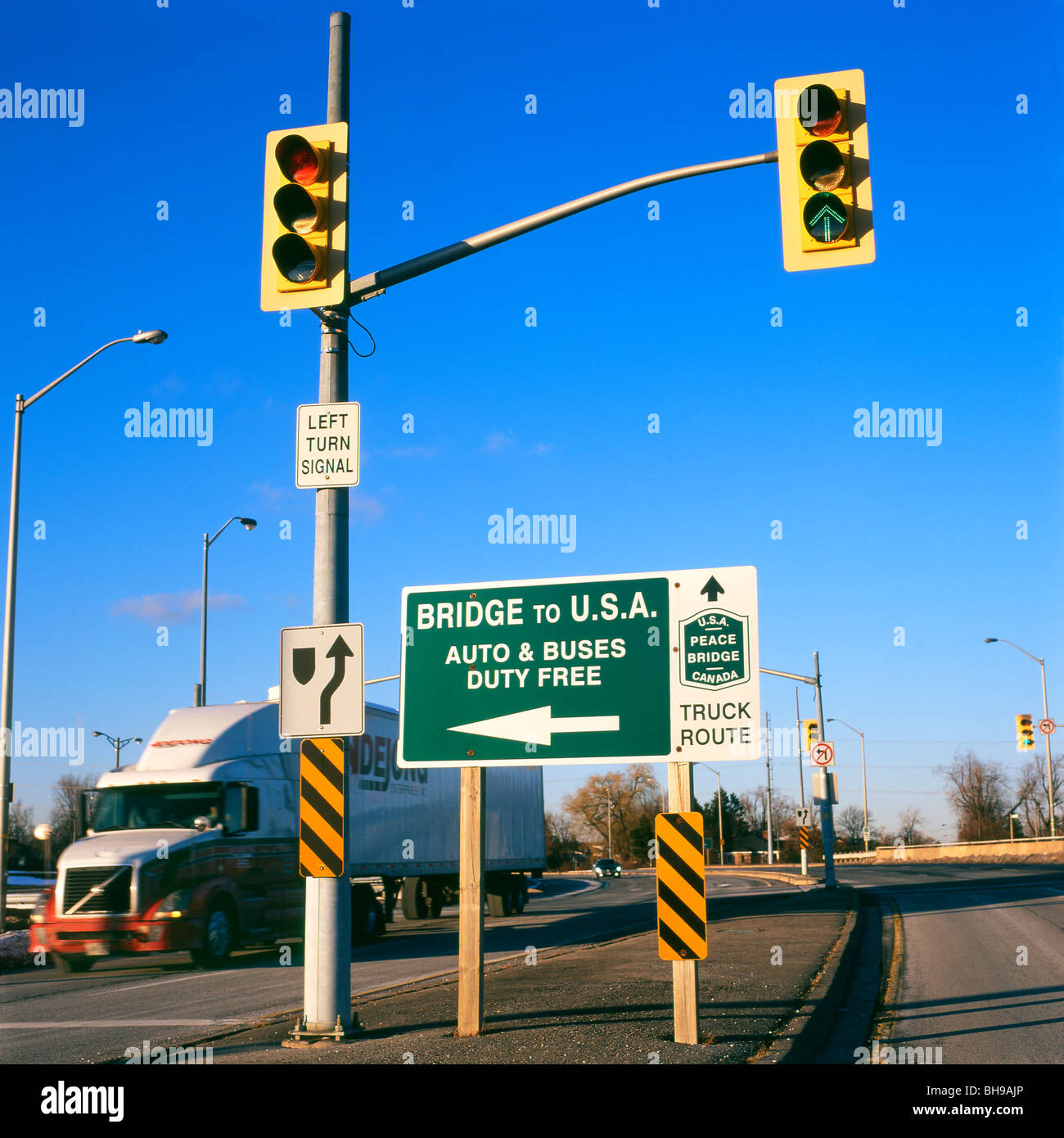 Truck, traffic lights and sign to cross the USA Canadian border at the