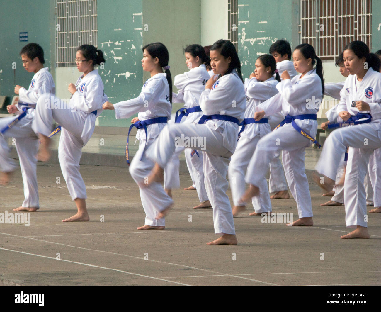 VIETNAM STUDENTS PRACTICING KARATE IN HANOI Photo © Julio Etchart Stock