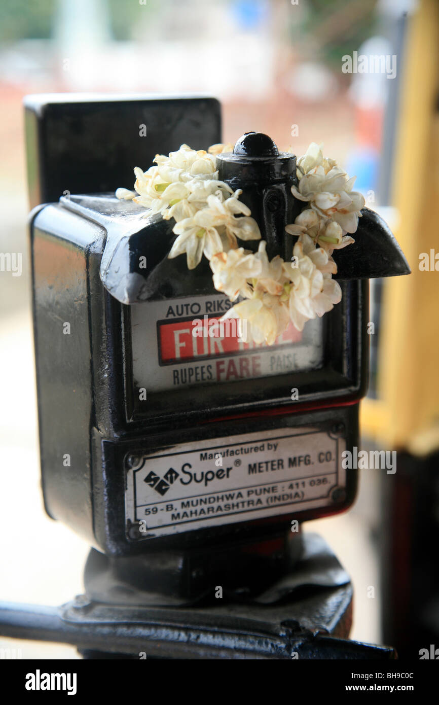Meter in an auto rickshaw decorated with a Jasmine garland. Stock Photo