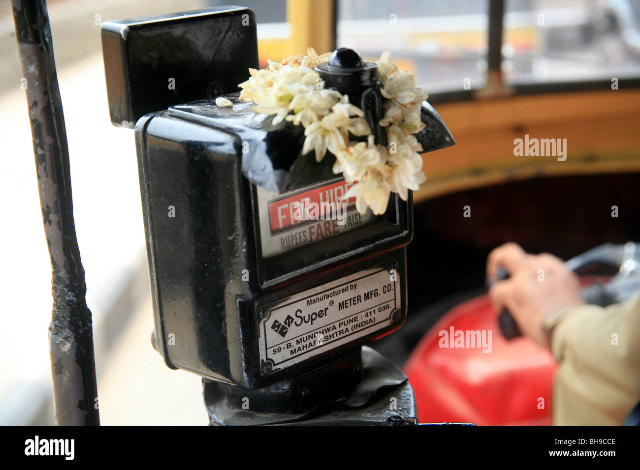 Meter in an auto rickshaw decorated with a Jasmine garland. Stock Photo