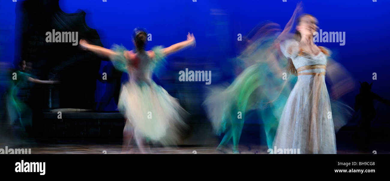 Cinderella and Fairy Godmother dancing with green fairies in Ballet Jorgen stage production panorama Stock Photo