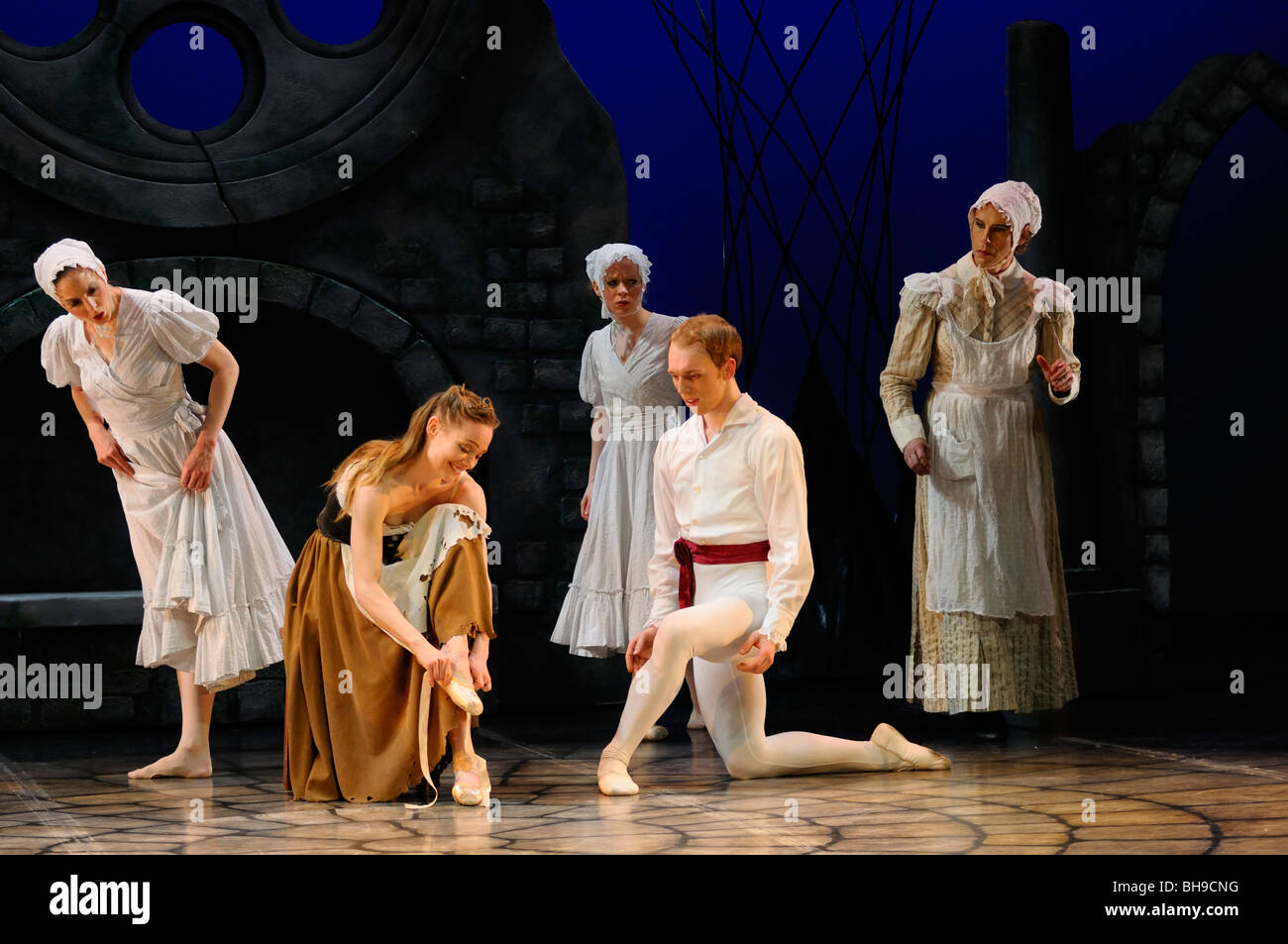 Cinderella trying on the other slipper at home with stepmother sisters and Prince Charming in Ballet Jorgen stage production Toronto Stock Photo