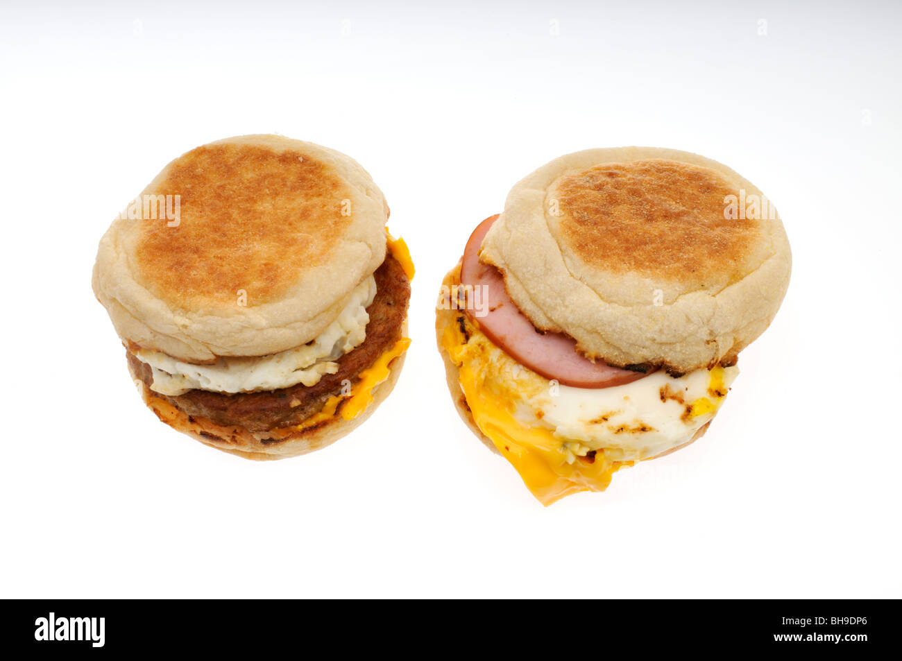 Sausage, egg and cheese and bacon, egg and cheese breakfast sandwiches on white background. Cut out. Stock Photo