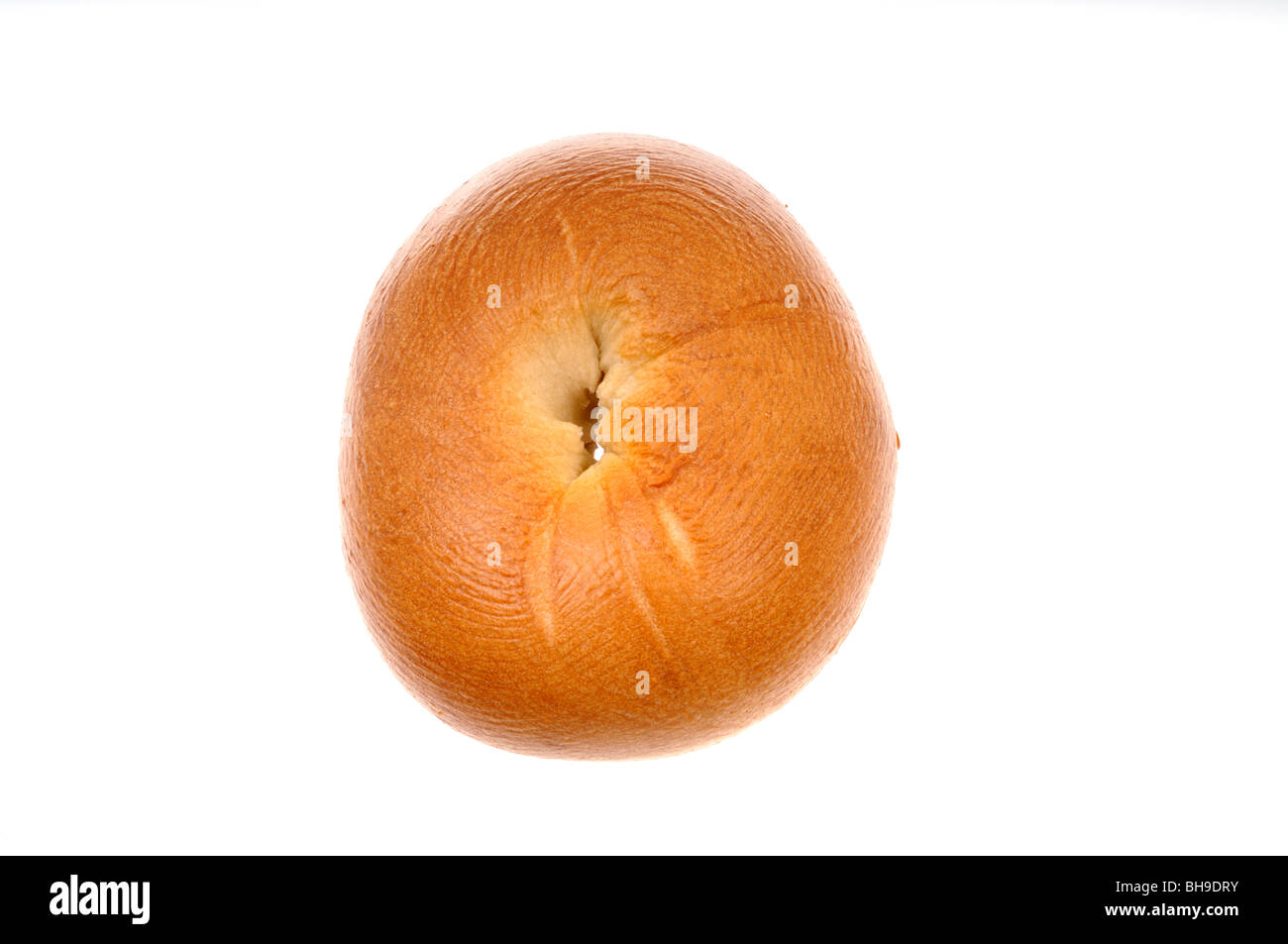 Plain round bagel or beigel not sliced from above on white background cutout. Stock Photo