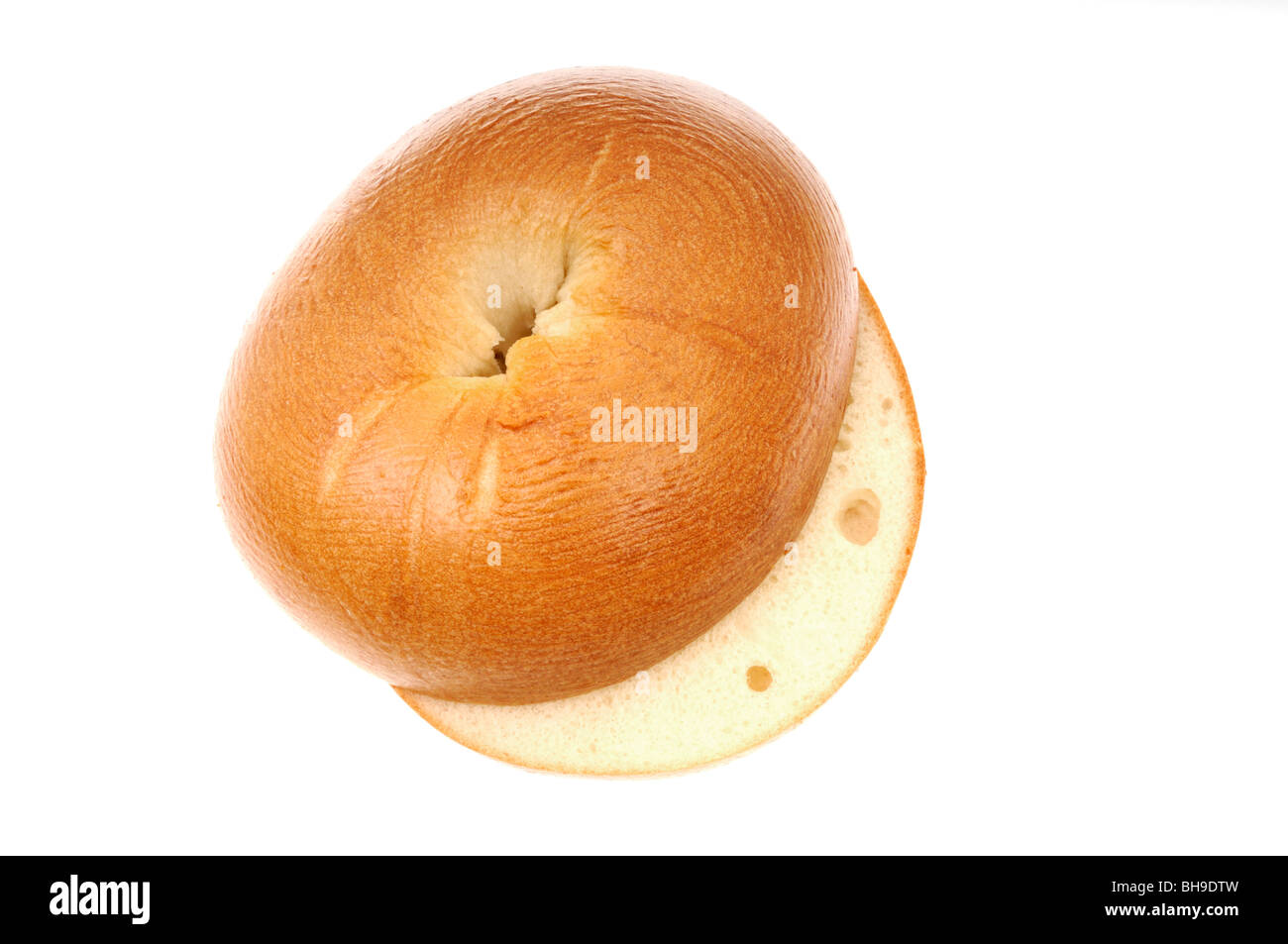 Plain bagel or beigel sliced on white background cutout. Stock Photo