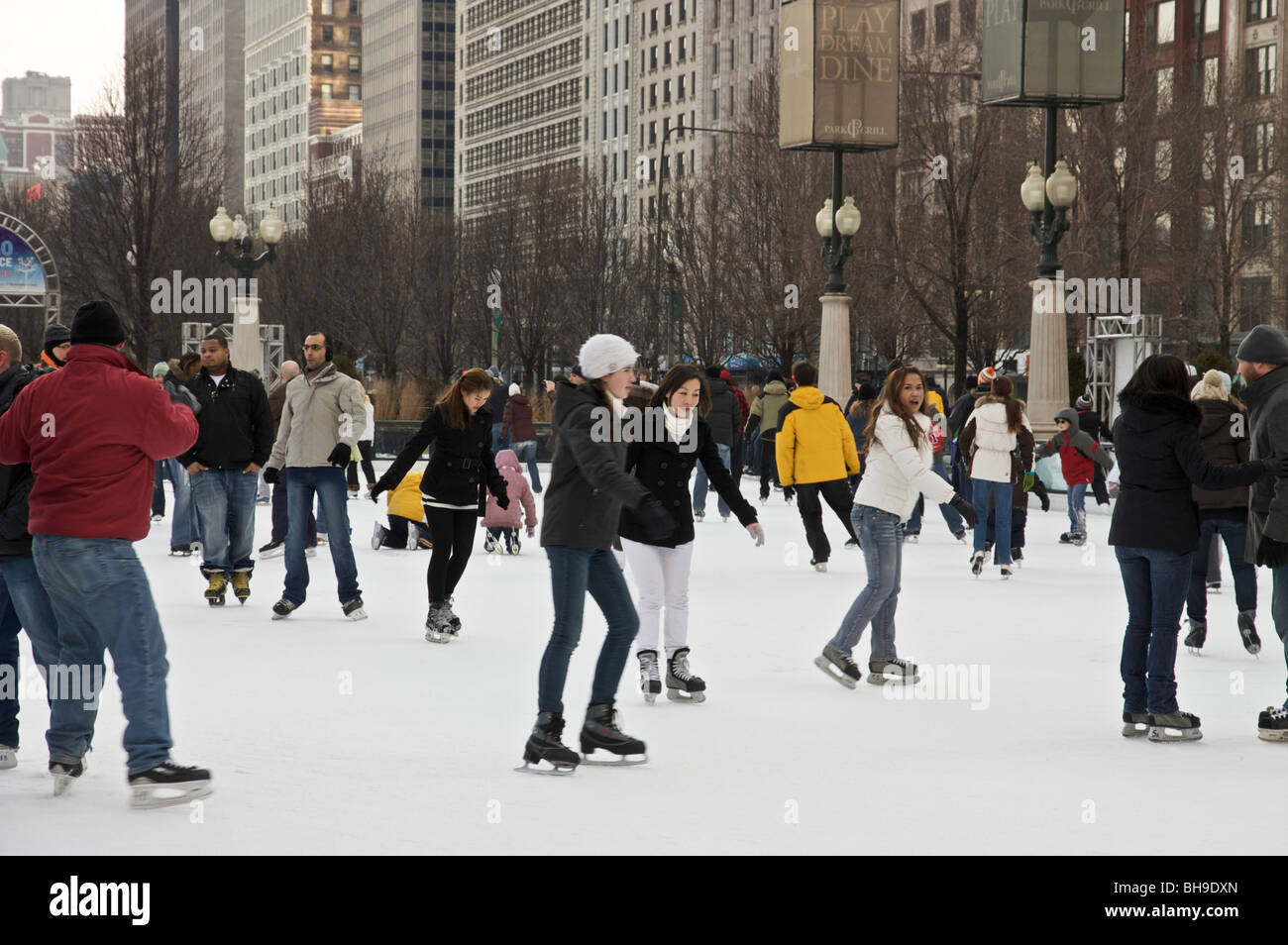 Ice skaters Millennium Park Chicago. McCormick Tribune ice rink. Stock Photo