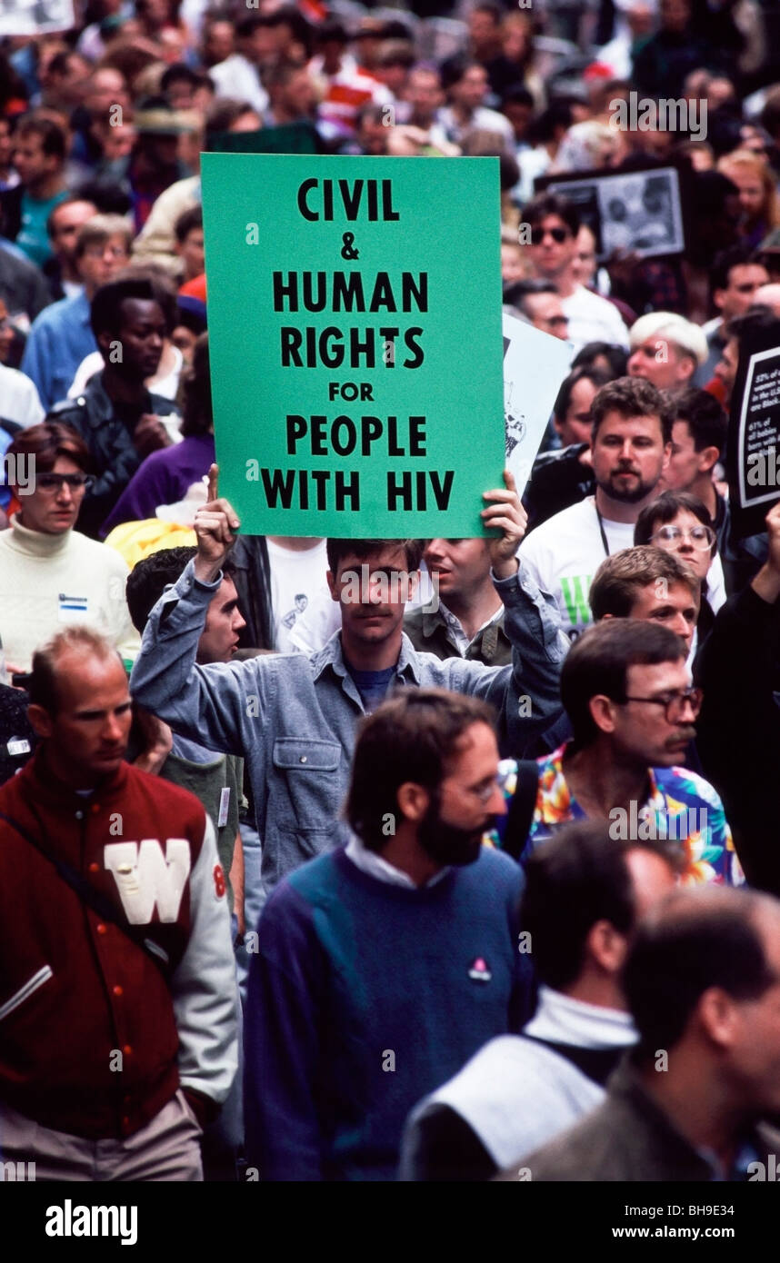Man holding a sign about ‘Human Rights for People with HIV’ during an ACT UP demonstration in San Francisco, California Stock Photo