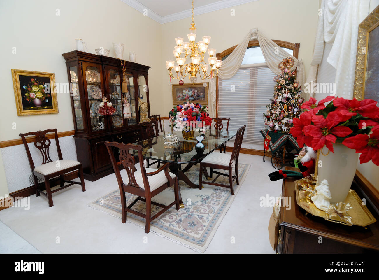 An elegant formal dining room decorated for the holiday season. Stock Photo