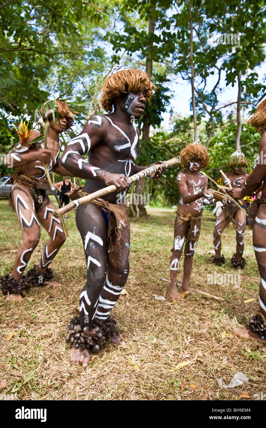 On Melanesia and Solomon Island itinerary local  warriors perform vigorous war dances as part of the welcoming ceremony Stock Photo