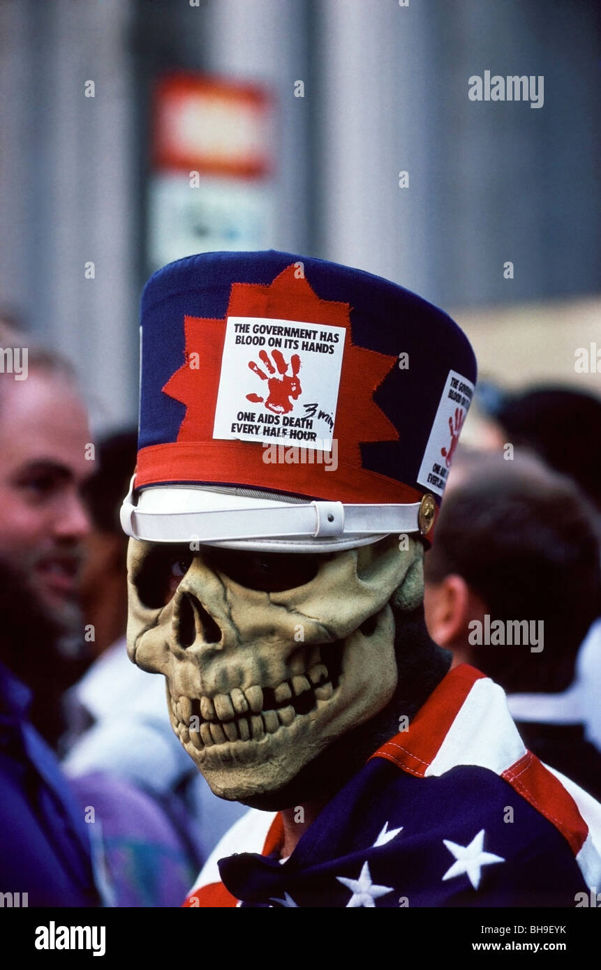 Man wearing a Red, White and Blue hat, Skeleton mask and American Flag during an ACT UP demonstration in San Francisco, CA. Stock Photo