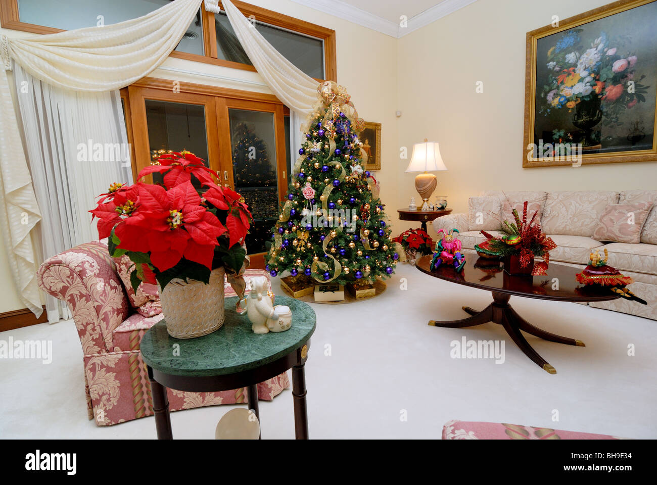 A tastefully decorated formal living room, decorated for the holiday season. Stock Photo