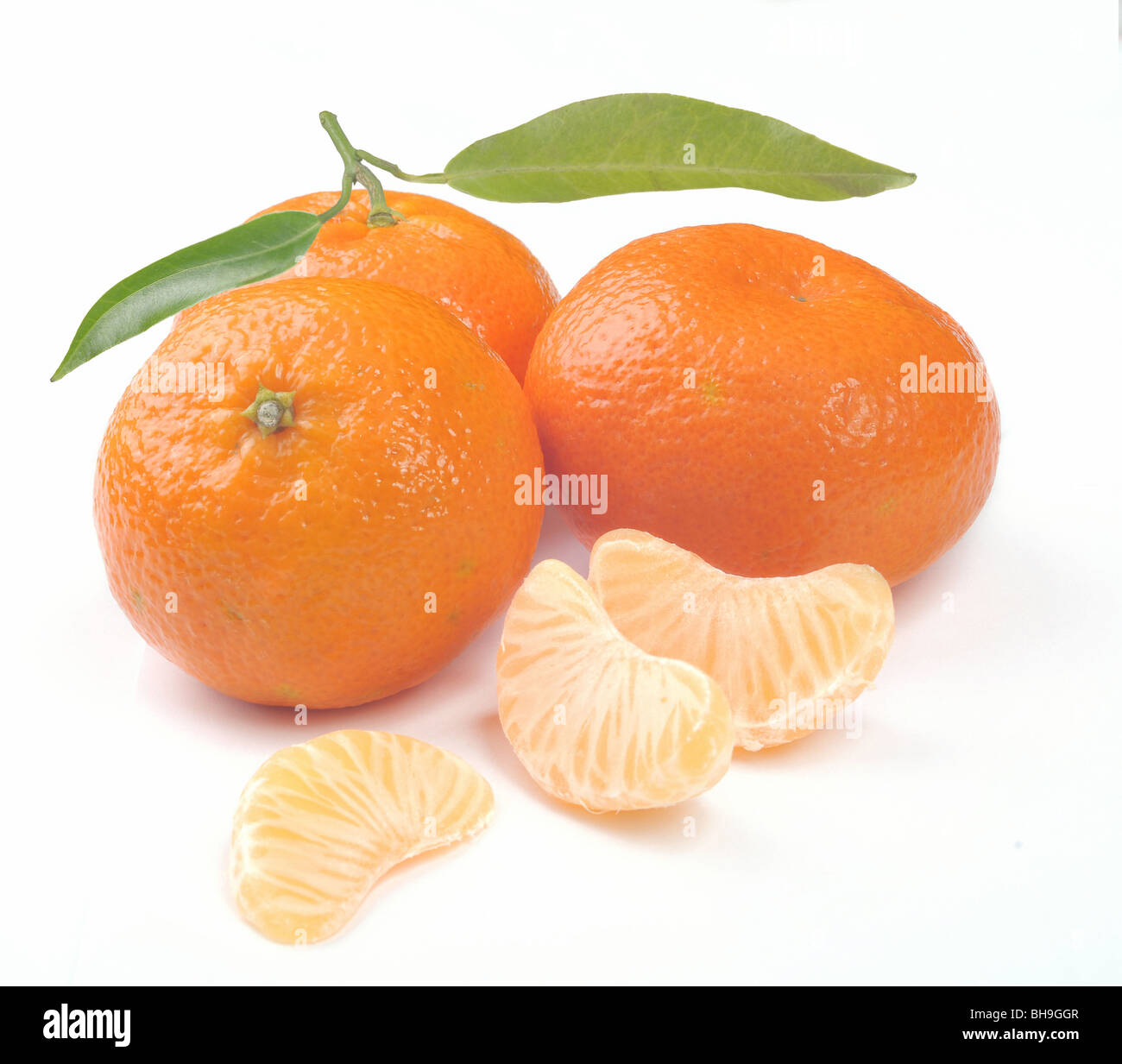 clementines with segments on a white background Stock Photo Alamy