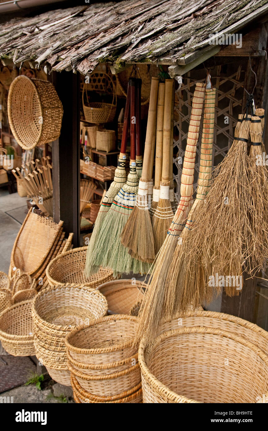 Shop front at a Japanese store with handmade bamboo handicrafts, wicker baskets, natural brooms etc at a traditional Japanese retail outlet. Stock Photo