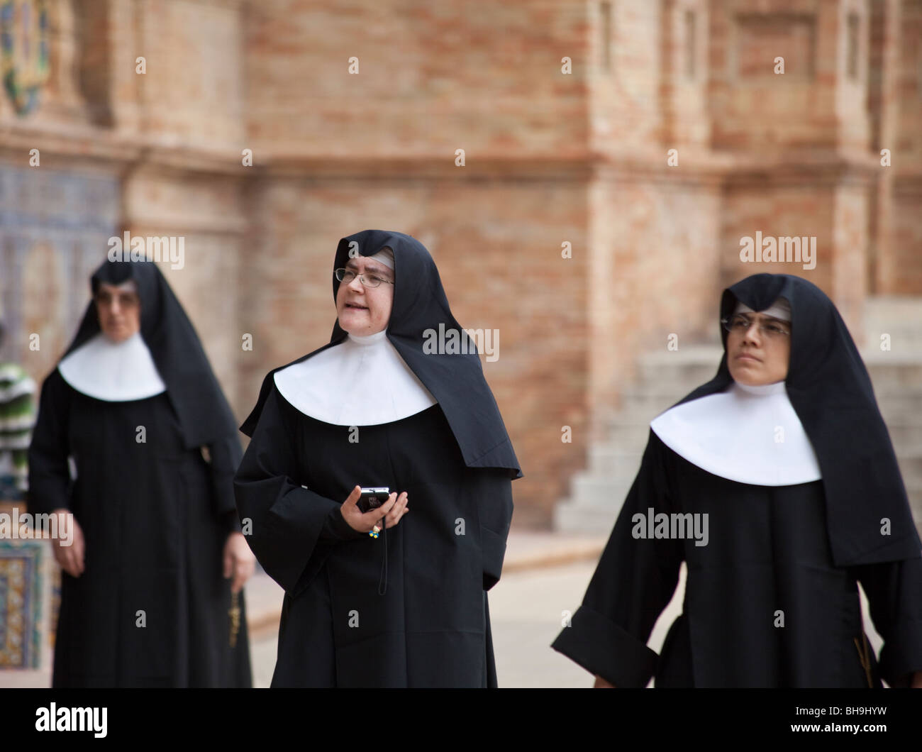 Spanish nuns, visiting Plaza de Espagna, Seville, Spain Stock Photo