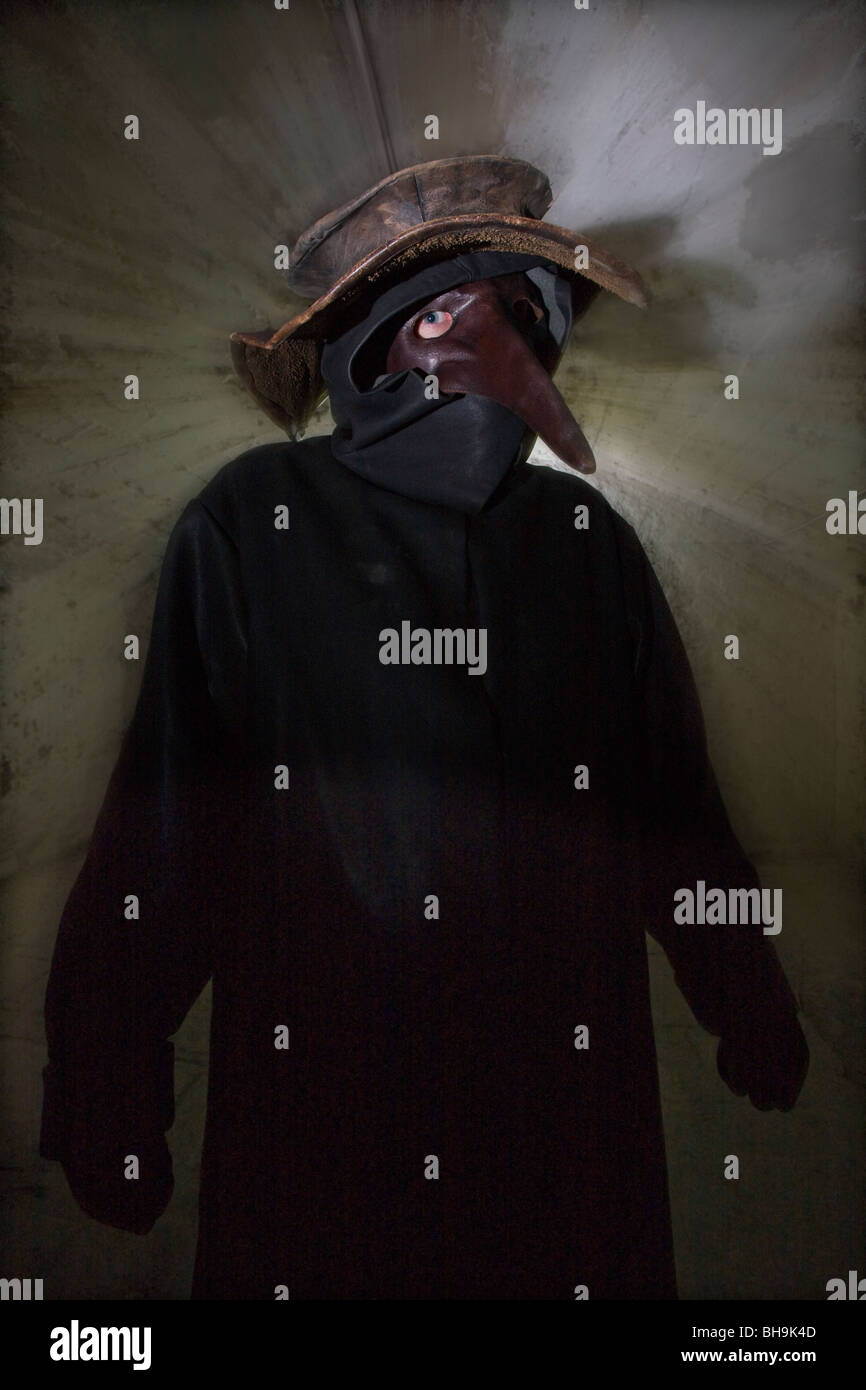 A tour guide dressed as the Plague doctor in the Real Mary King's Close tourist attraction in Edinburgh Stock Photo