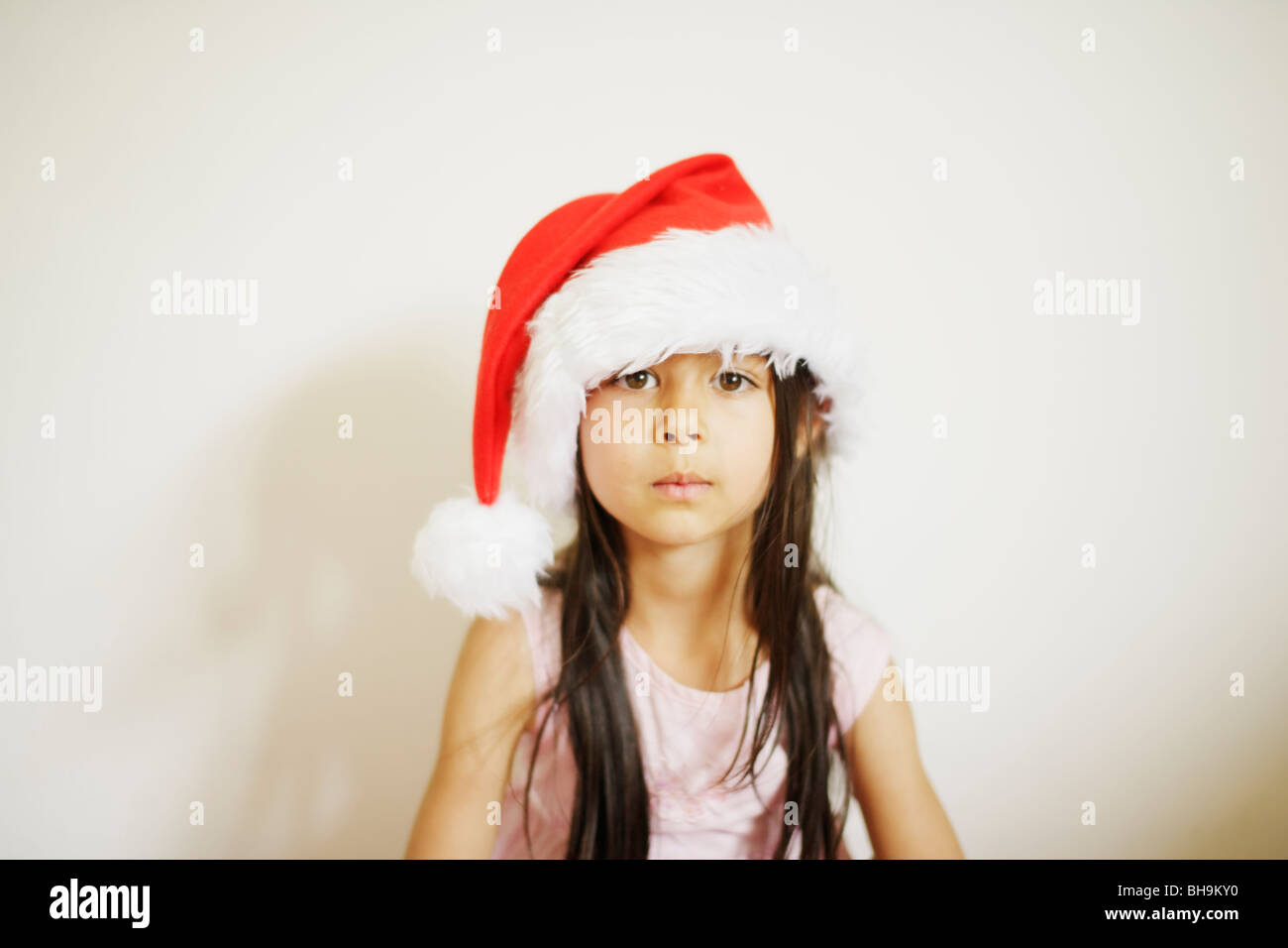 Six year old girl with santa hat Stock Photo
