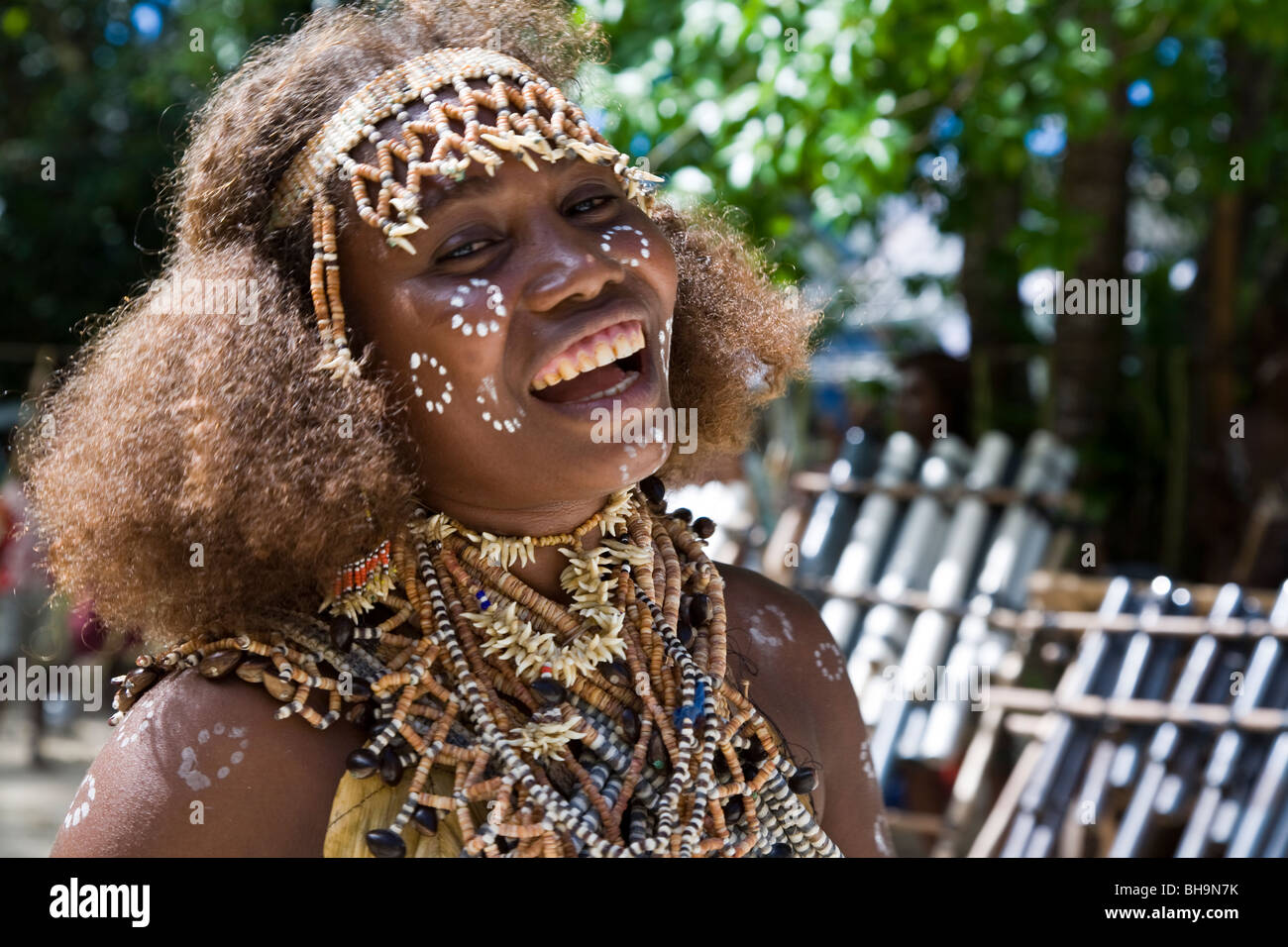 A young woman of Nggela Island in traditional costume dances for passengers of Aussie cruiser Orion Stock Photo