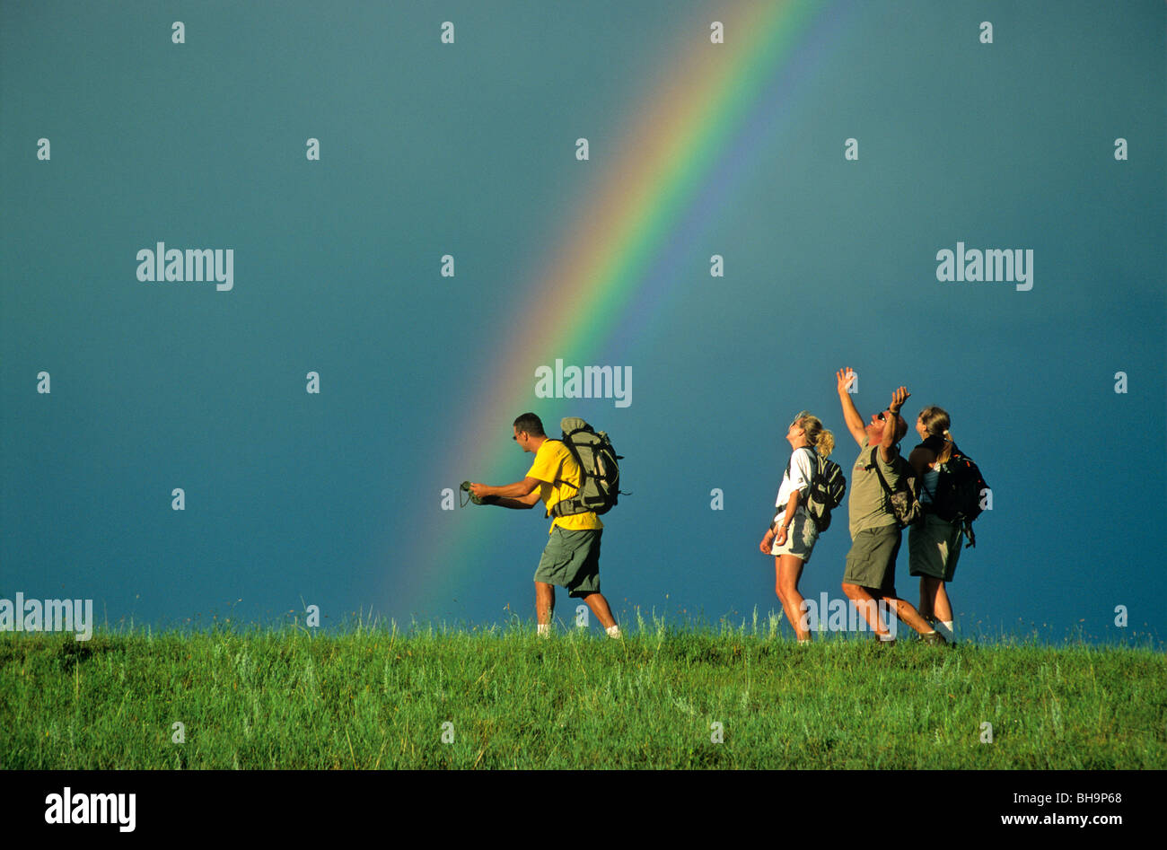 Hikers catching a rainbow at Little Missouri National Grassland, North Dakota, USA Stock Photo