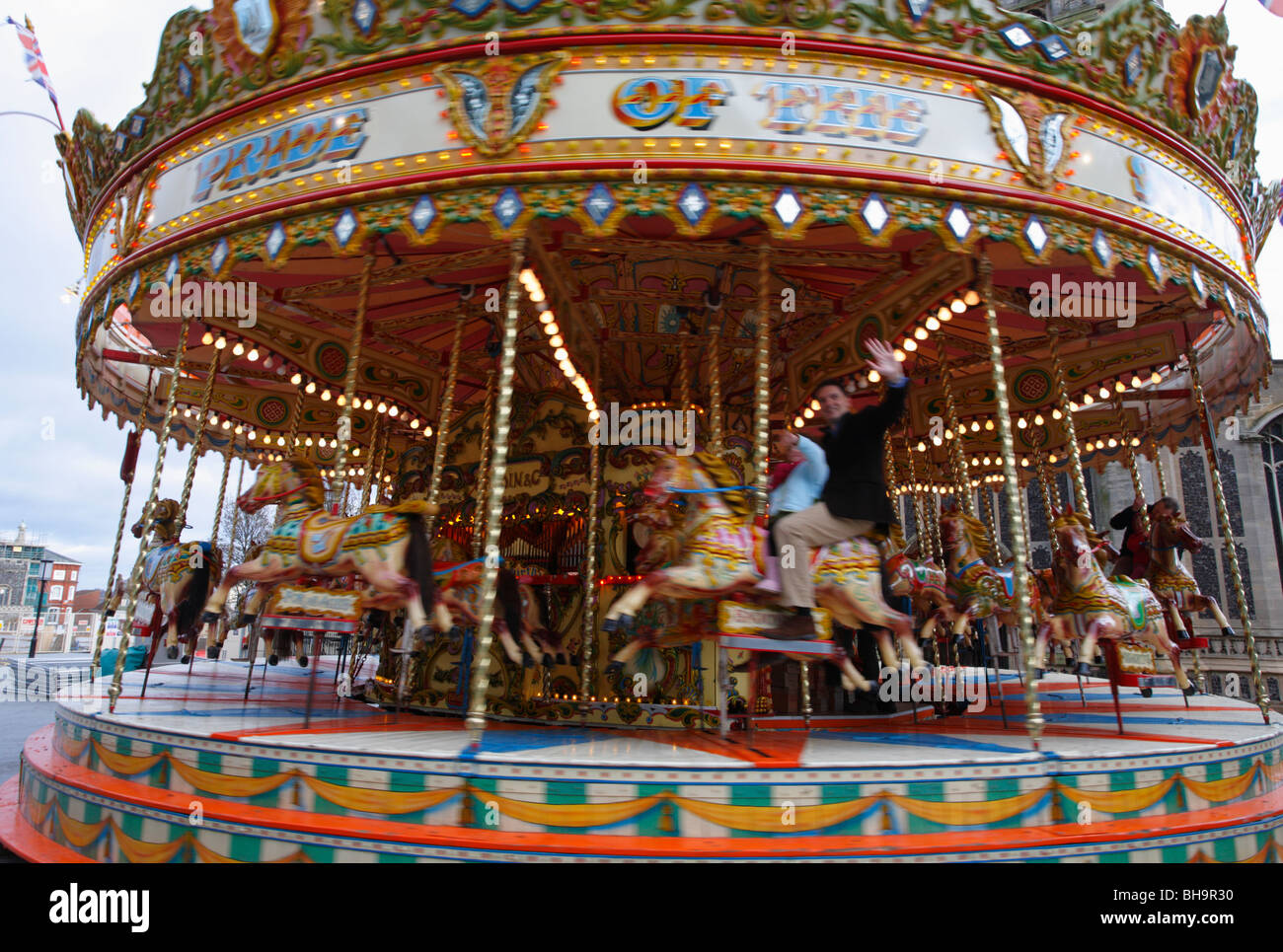 The Pride of the South Galloping Horses carousel ride working in Nowich. Stock Photo