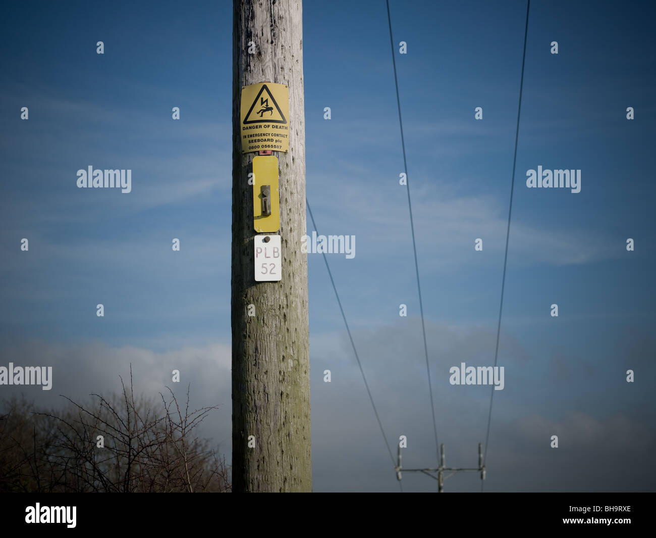 high voltage pylon running through countryside Stock Photo - Alamy