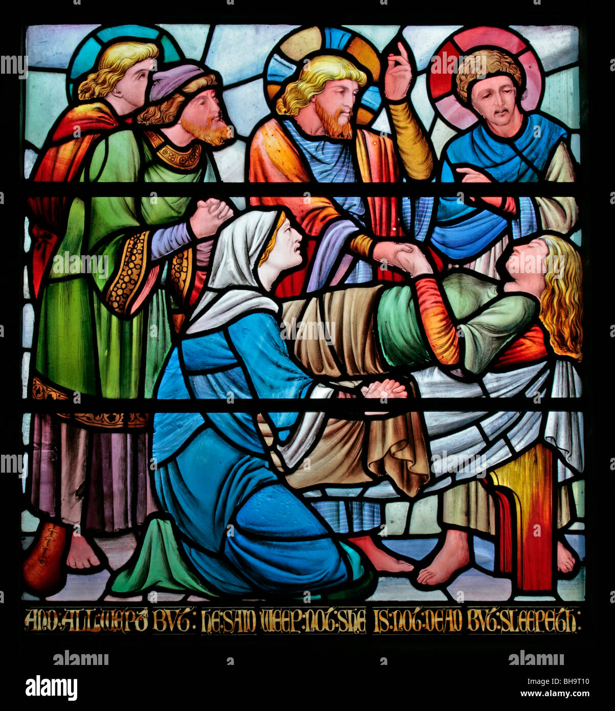 Stained glass window designed by Horatio Walter Lonsdale depicting Jesus raising the maid from the dead, Church of Christ the Consoler, Skelton-on-Ure Stock Photo