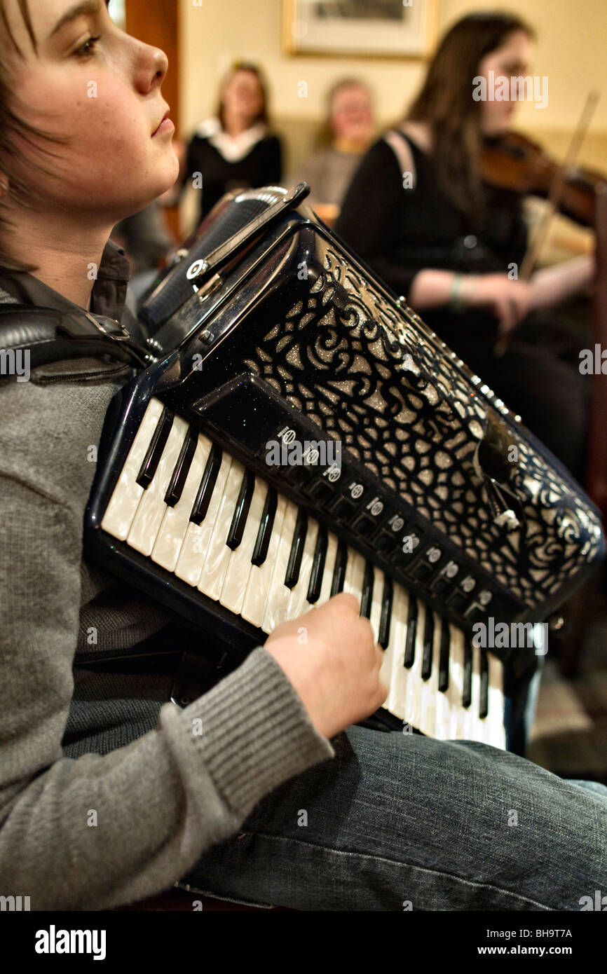 Young accordion player Scott Turnbull in a Scottish Borders folk music session 2010 Stock Photo