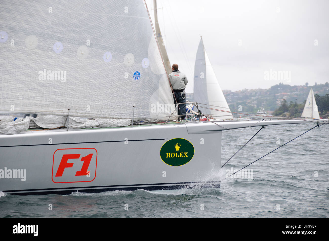 SYDNEY, Australia - SYDNEY, Australia - Super maxi yach Alfa Romeo at the start of the 2009 Rolex Sydney to Harbour Yacht Race in Sydney Harbour. Alfa Romeo was the eventual winner on overall line honors.. It was skippered by Neville Crichton. Stock Photo