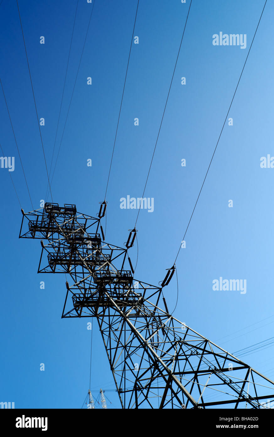 Overhead power line against blue sky Stock Photo - Alamy