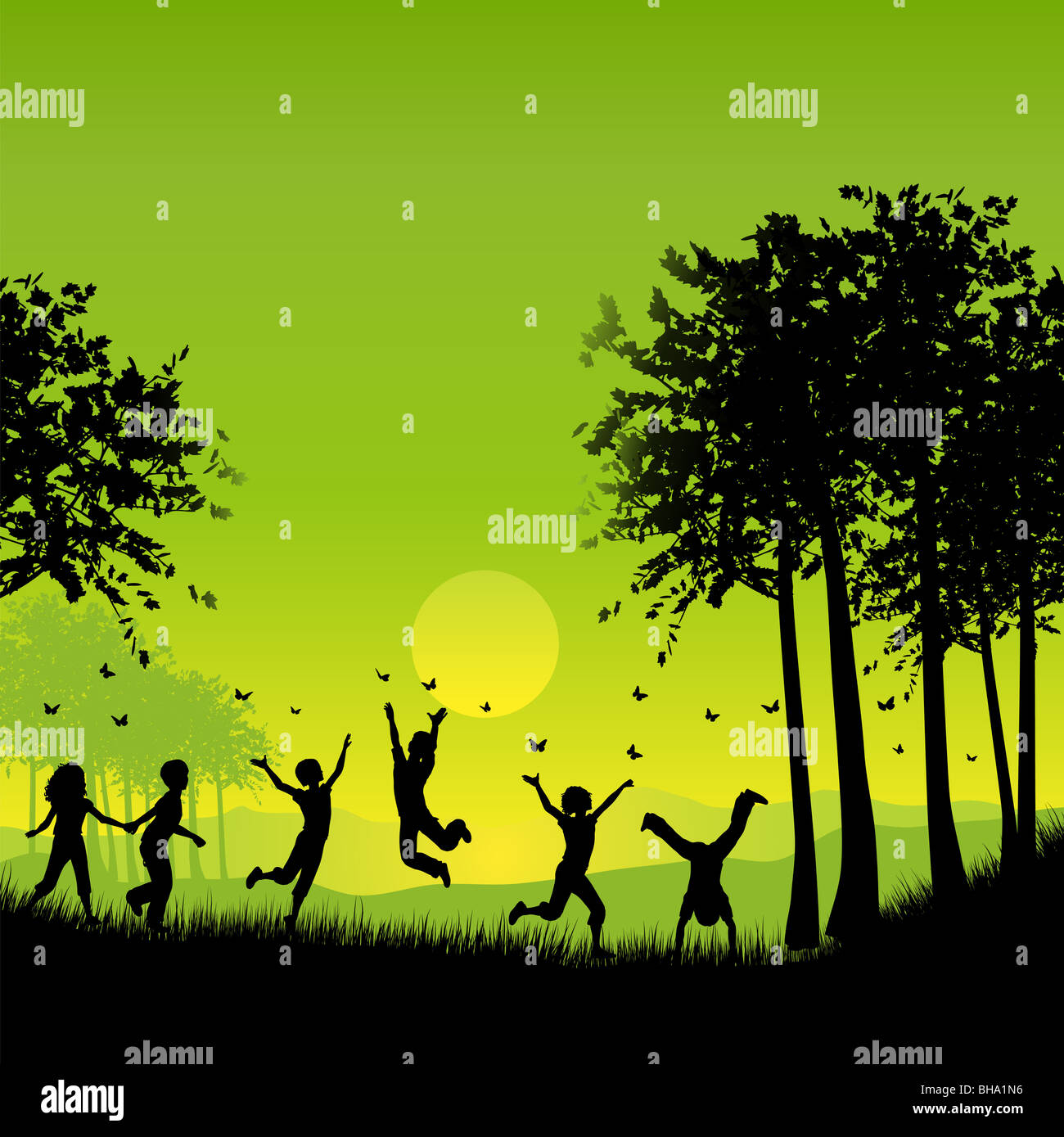 Silhouettes of children playing outside chasing butterflies Stock Photo