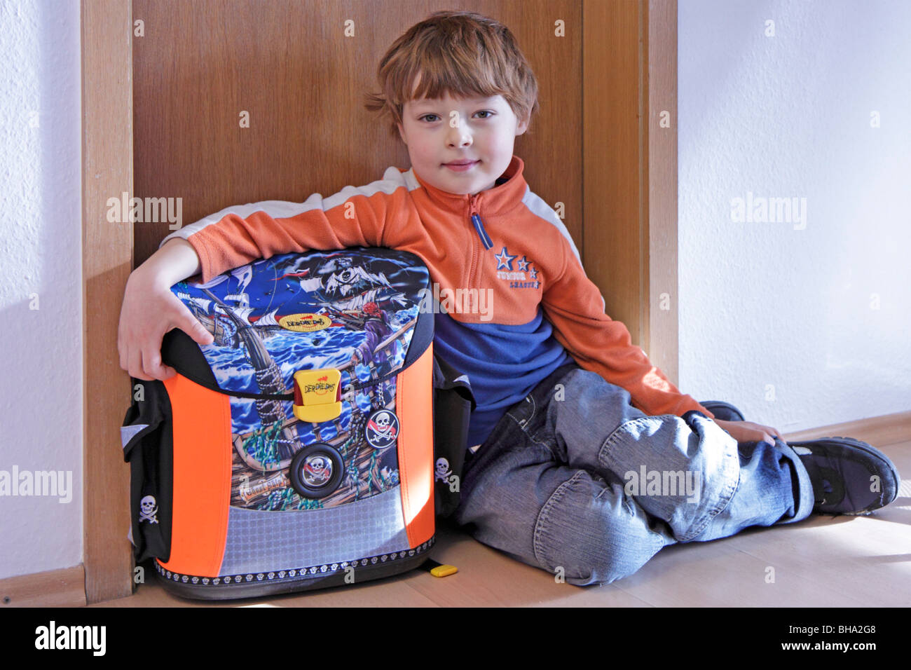 portrait of a young boy with his schoolbag Stock Photo