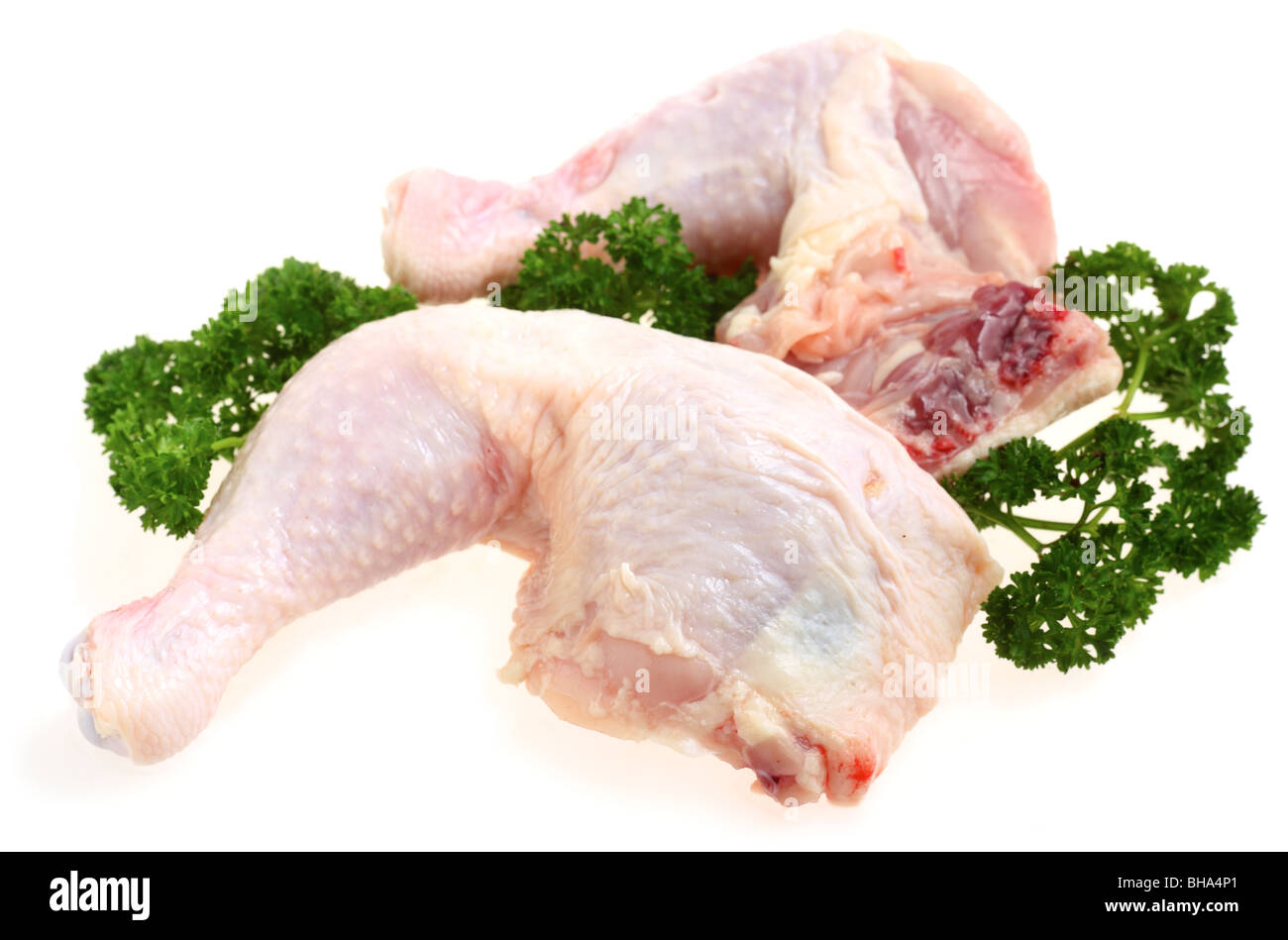 Fresh chicken legs garnished with parsley over a white background Stock  Photo - Alamy