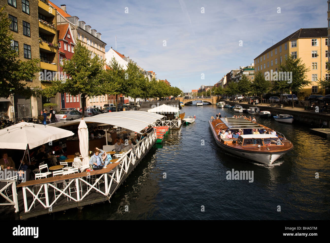 Canal boat tours and sidewalk harborside cafes Copenhagen Denmark Stock Photo Alamy