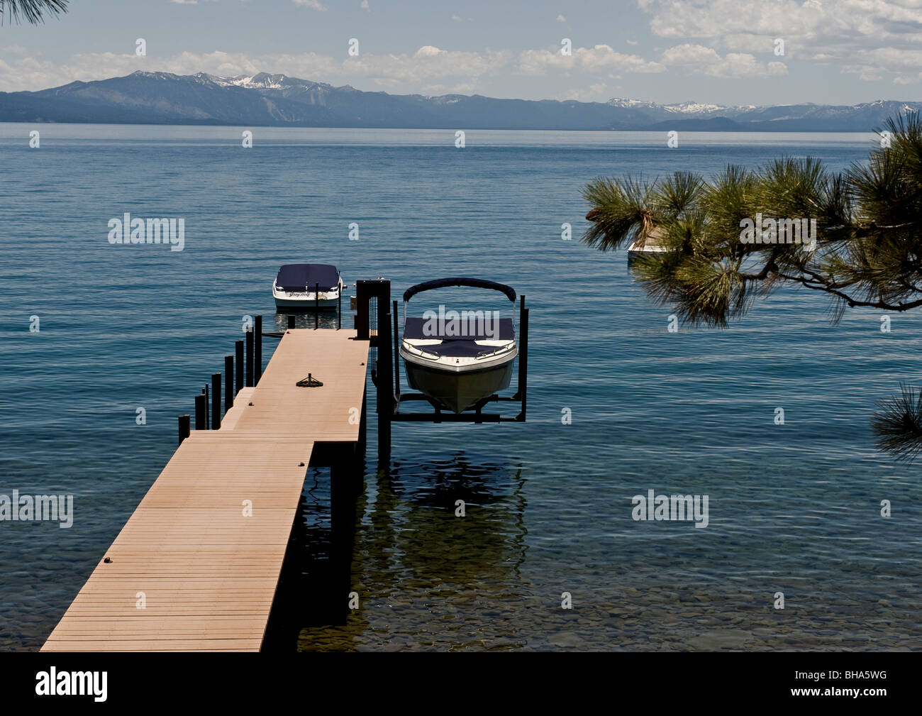 Wooden pier leading into lake hi-res stock photography and images - Alamy