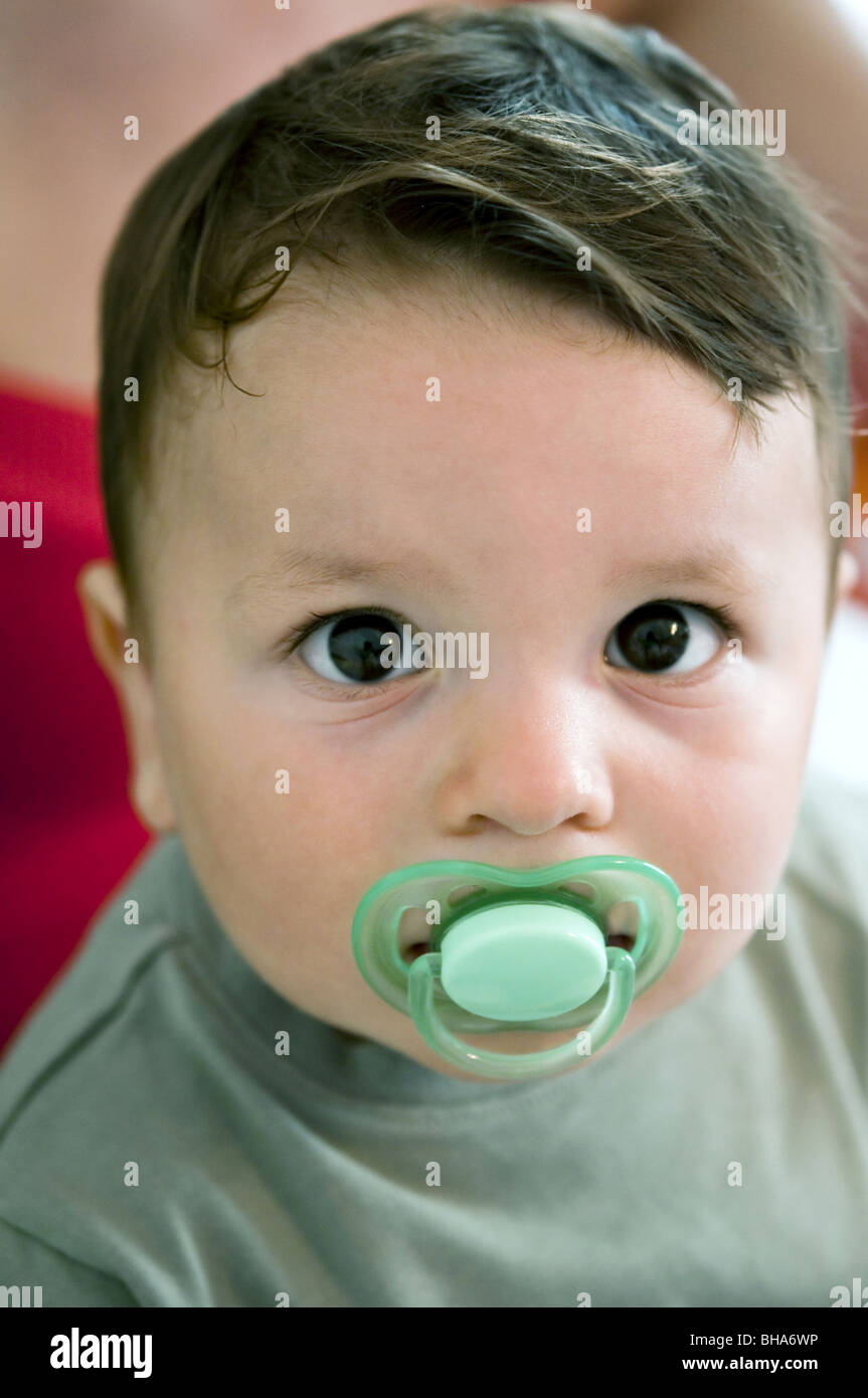 Baby boy with pacifier Stock Photo Alamy