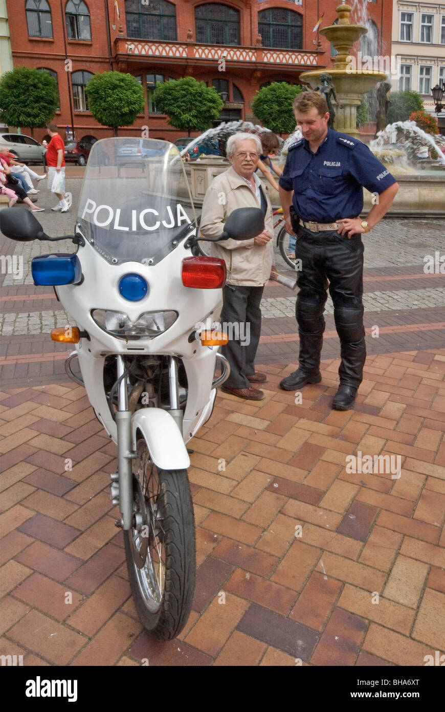 Local police officer and his motorcycle during Police Festival at Stary Rynek (Old Market Square) in Chojnice, Pomorskie, Poland Stock Photo