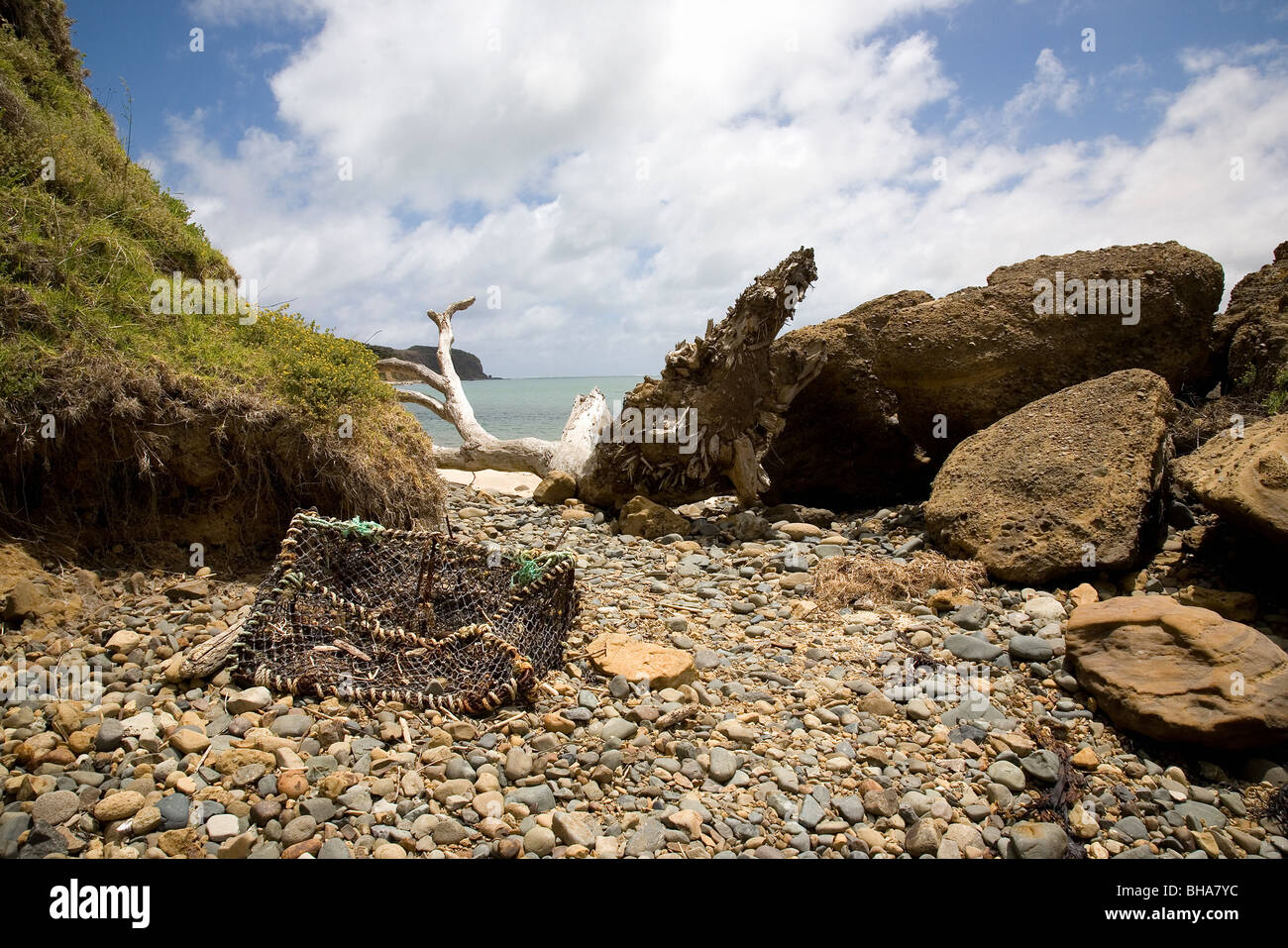 Rock and debris on Omapere beach, New Zealand Stock Photo